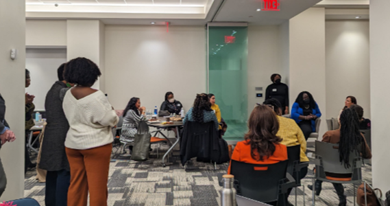 People listen at a Transforming Academic for Equity meeting